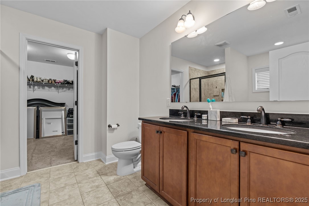182 Valley Stream Road Spring Lake, NC 28390 - Photo 14 of 26 a kitchen with stainless steel appliances a sink stove and cabinets