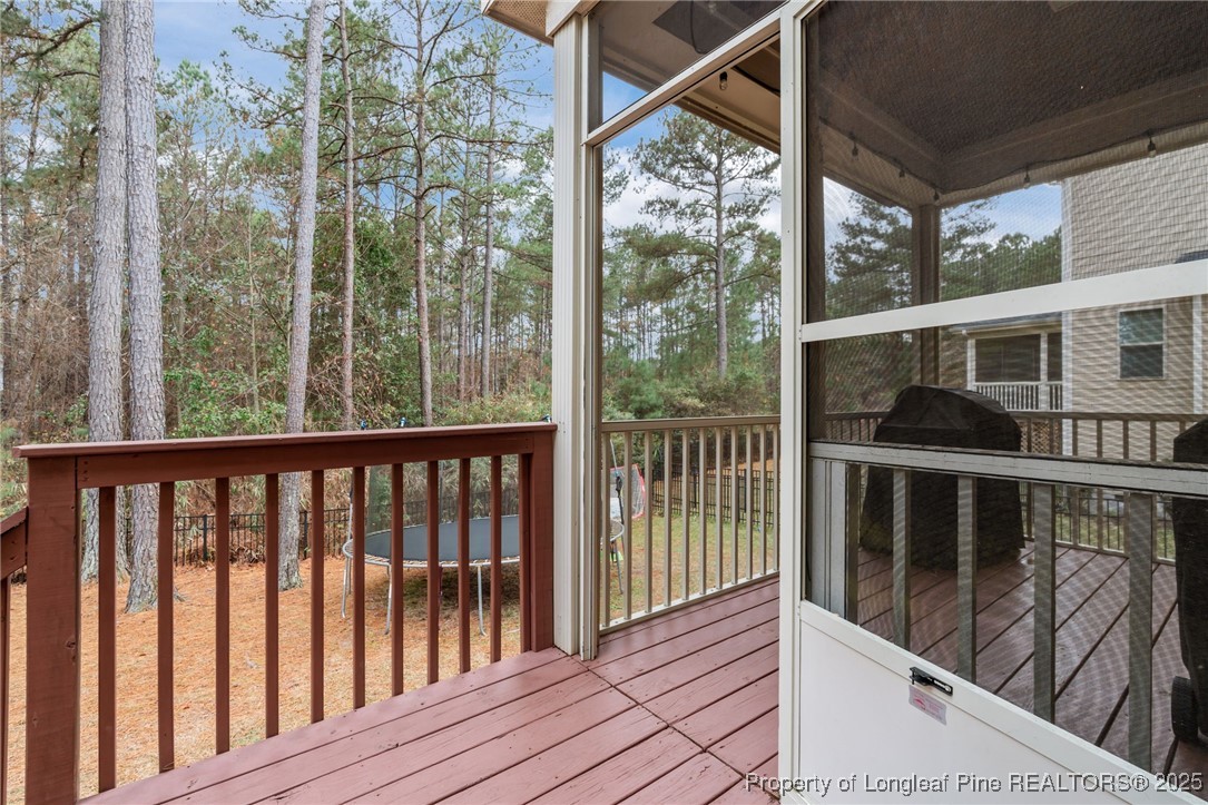 182 Valley Stream Road Spring Lake, NC 28390 - Photo 19 of 26 a view of a balcony with wooden floor