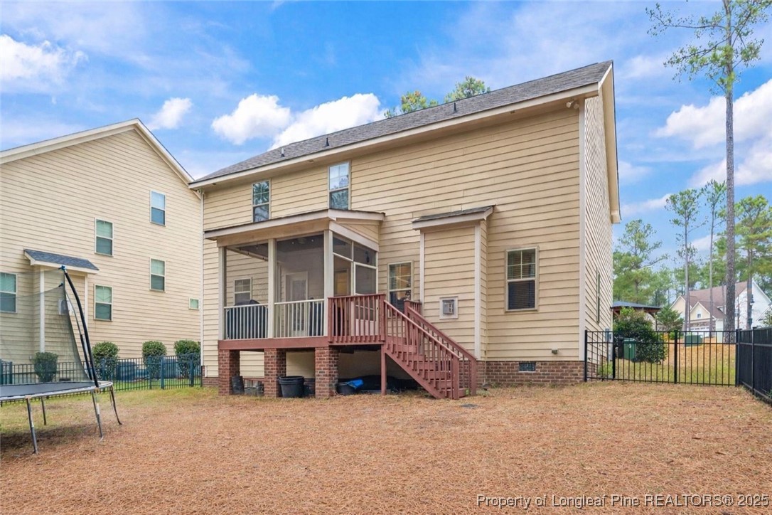 182 Valley Stream Road Spring Lake, NC 28390 - Photo 23 of 26 a view of a house with backyard and a tree