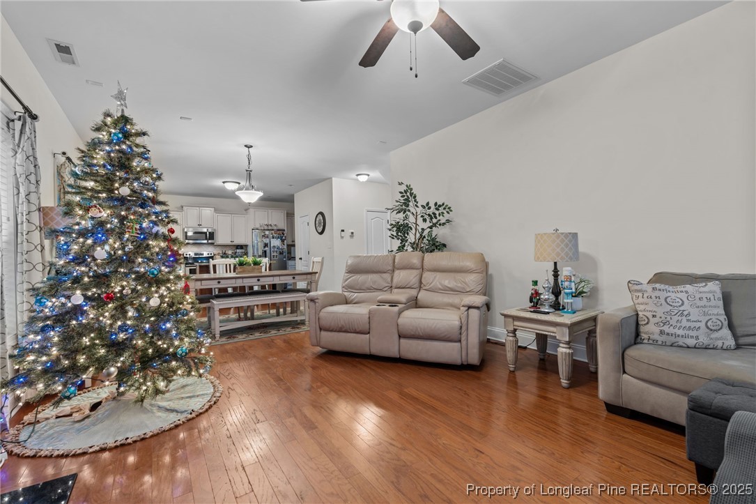 182 Valley Stream Road Spring Lake, NC 28390 - Photo 3 of 26 a living room with furniture and a chandelier