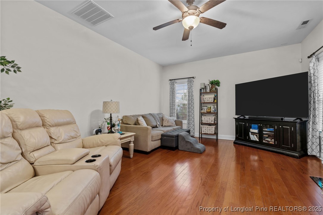182 Valley Stream Road Spring Lake, NC 28390 - Photo 4 of 26 a living room with furniture and a flat screen tv