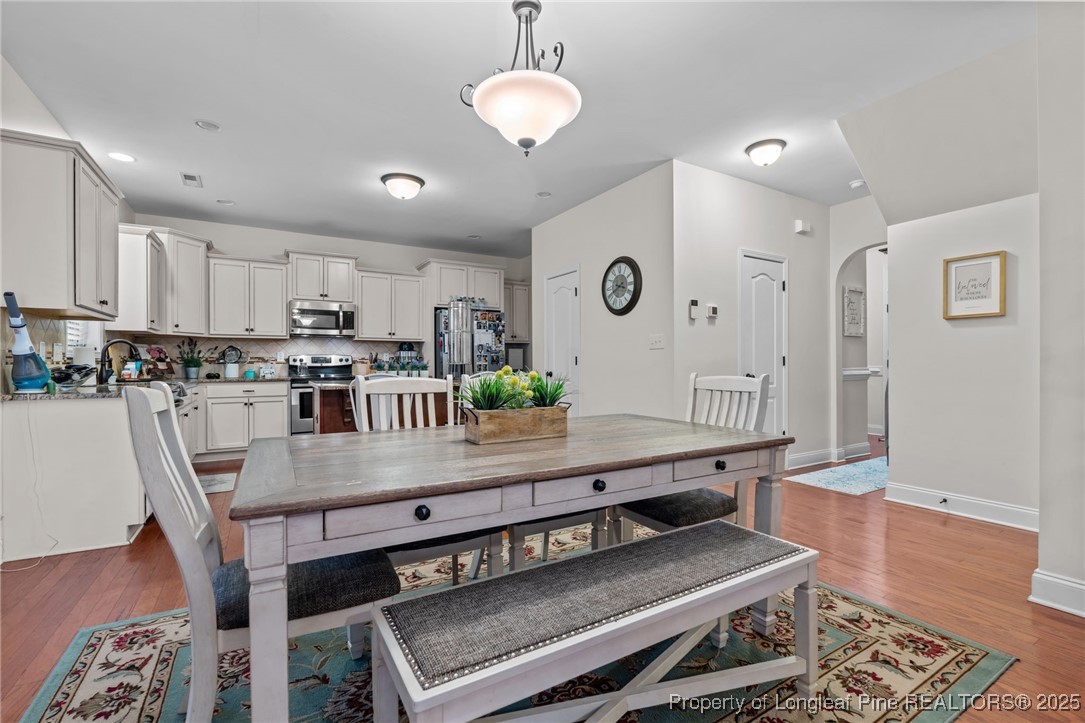 182 Valley Stream Road Spring Lake, NC 28390 - Photo 5 of 26 a kitchen with a table and chairs in it