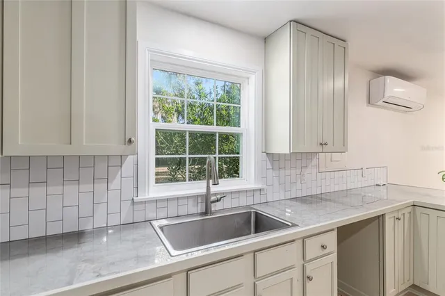 a kitchen with a sink and cabinets