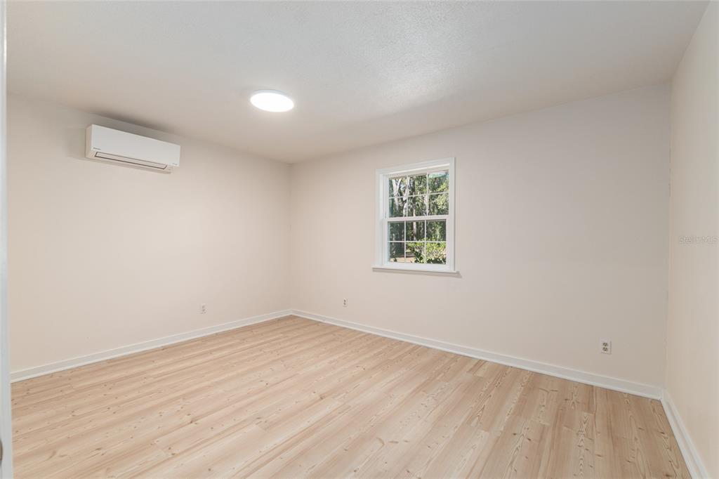 18124 Southwest 75 Avenue Archer, FL 32618 - Photo 17 of 52 an empty room with a window