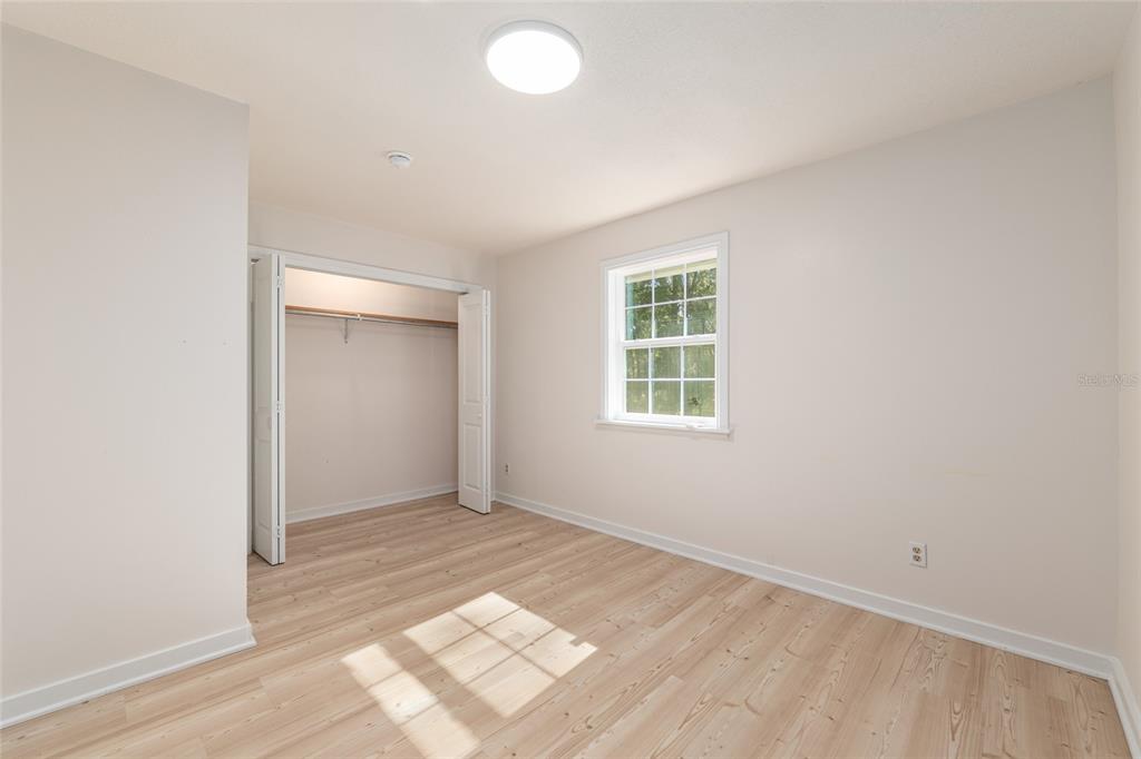 18124 Southwest 75 Avenue Archer, FL 32618 - Photo 22 of 52 an empty room with windows