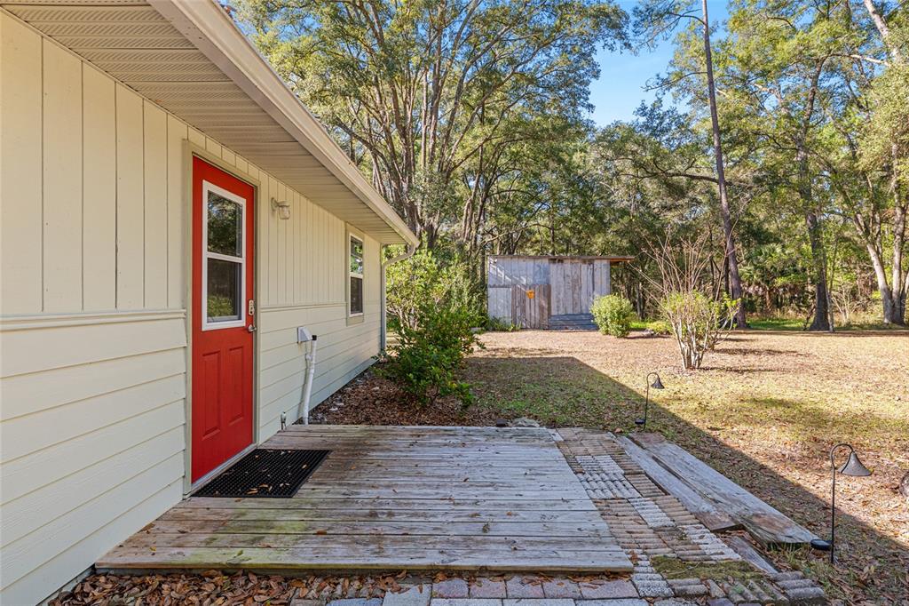 18124 Southwest 75 Avenue Archer, FL 32618 - Photo 23 of 52 a view of a yard with plants and trees