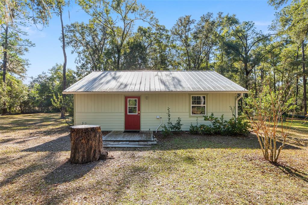 18124 Southwest 75 Avenue Archer, FL 32618 - Photo 24 of 52 a view of a house with backyard and sitting area