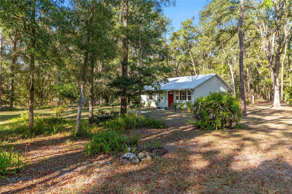 18124 Southwest 75 Avenue Archer, FL 32618 - Photo 32 of 52 a front view of a house with a yard