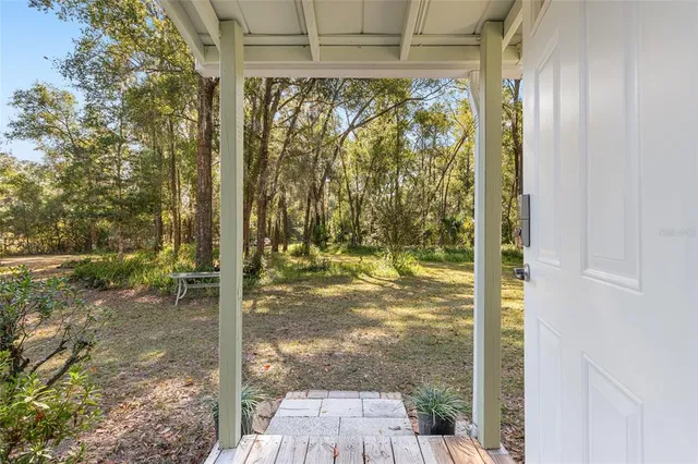 a view of a glass door and porch