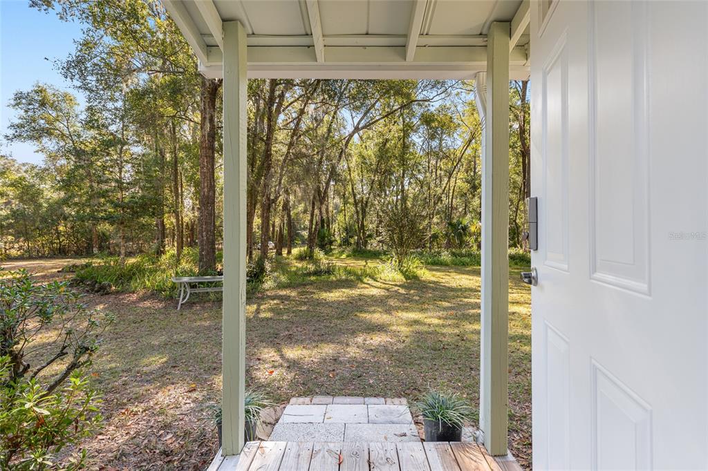 18124 Southwest 75 Avenue Archer, FL 32618 - Photo 4 of 52 a view of a glass door and porch