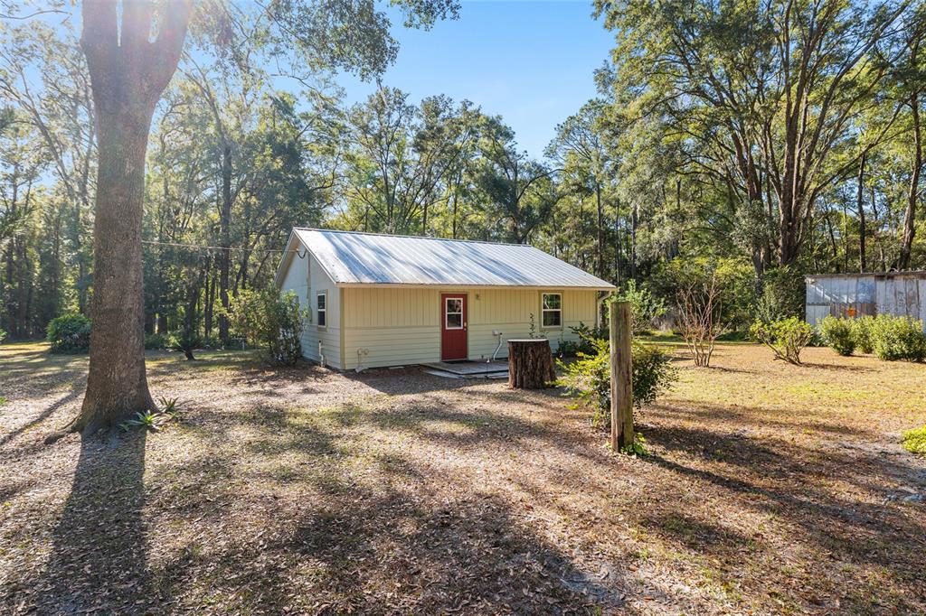 18124 Southwest 75 Avenue Archer, FL 32618 - Photo 44 of 52 a view of a house with a yard and tree