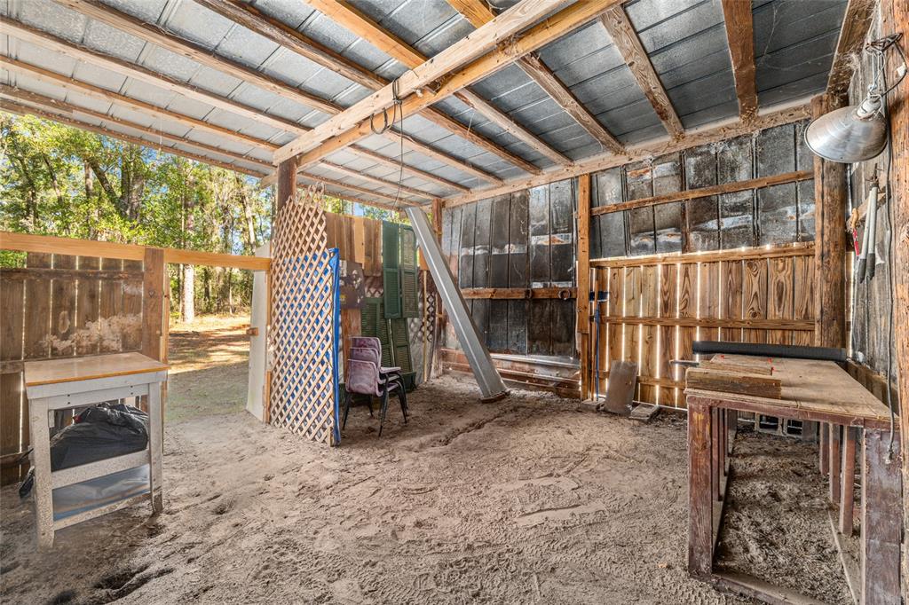 18124 Southwest 75 Avenue Archer, FL 32618 - Photo 46 of 52 a view of a room with wooden stairs and furniture