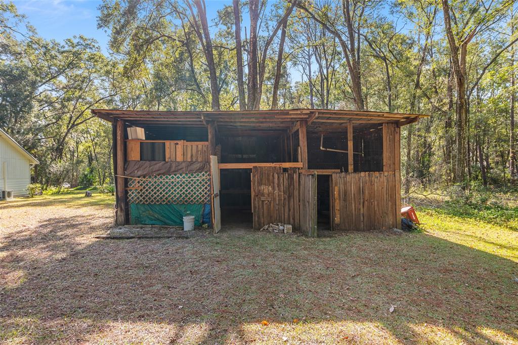 18124 Southwest 75 Avenue Archer, FL 32618 - Photo 47 of 52 a view of a house with a yard
