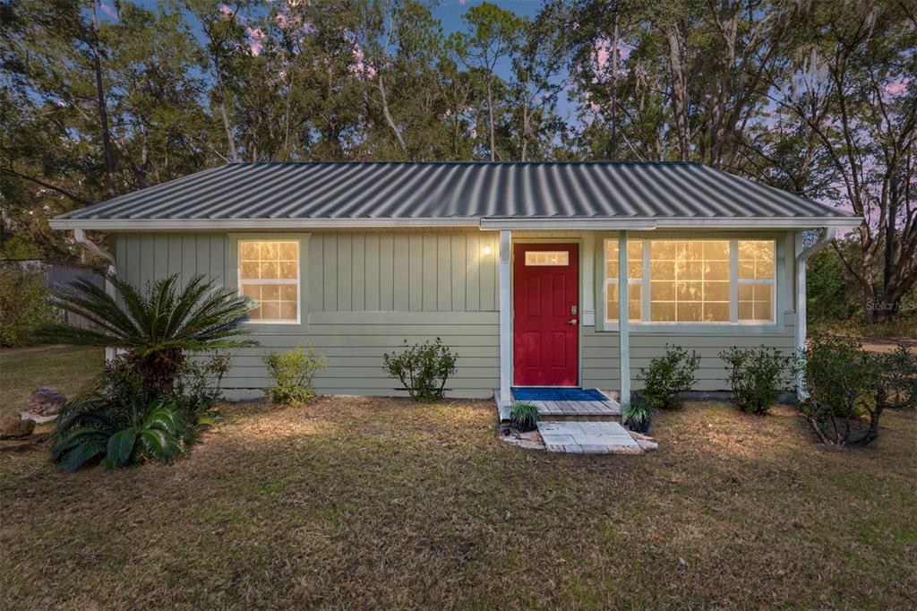 18124 Southwest 75 Avenue Archer, FL 32618 - Photo 52 of 52 a backyard of a house with barbeque oven