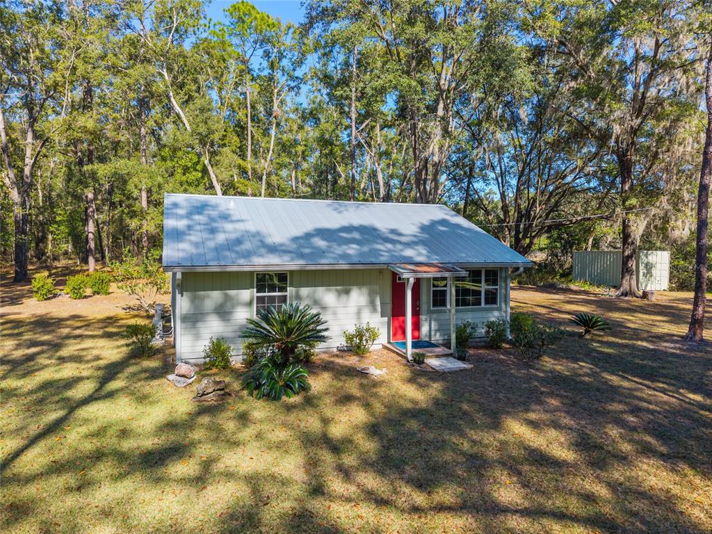 18124 Southwest 75 Avenue Archer, FL 32618 - Photo 6 of 52 a view of outdoor space yard and front view of a house