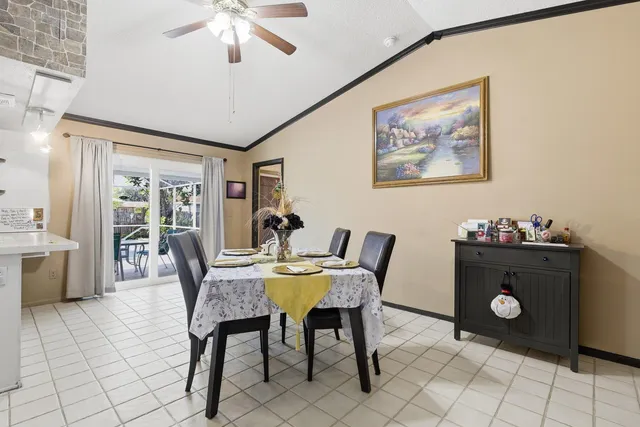 a dining room with furniture and window