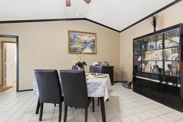 a view of a dining room with furniture and a window