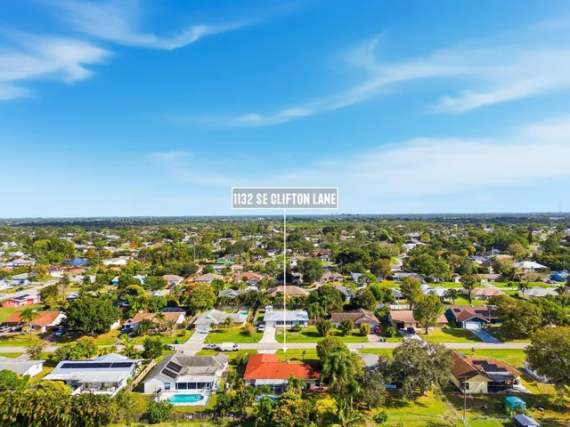 an aerial view of residential building and ocean