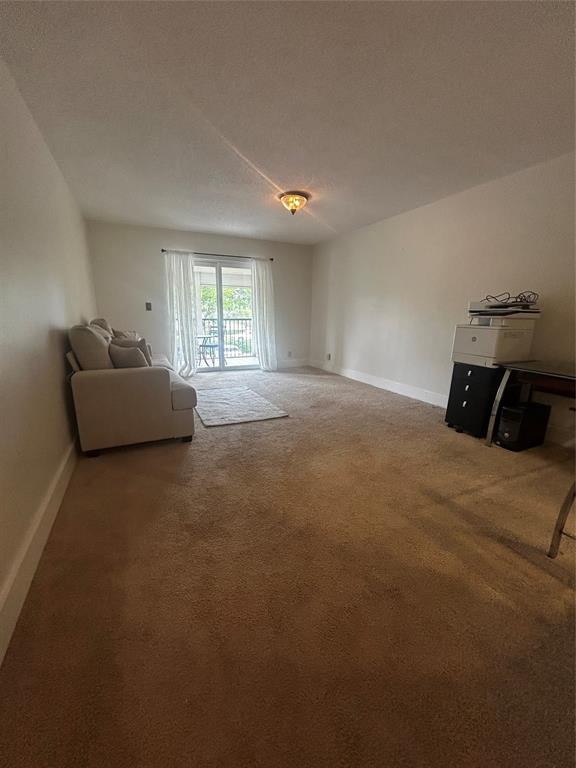 251 South Cypress Road, Unit 120 Pompano Beach, FL 33060 - Photo 15 of 42 a living room with furniture and a window