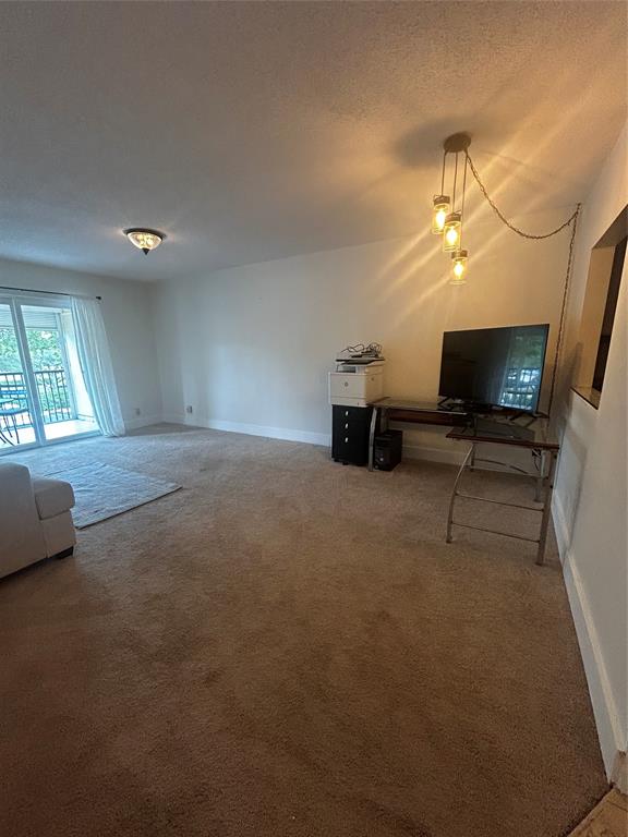 251 South Cypress Road, Unit 120 Pompano Beach, FL 33060 - Photo 16 of 42 a view of empty room with a flat screen tv