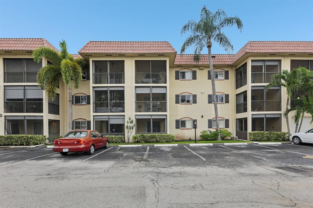 251 South Cypress Road, Unit 120 Pompano Beach, FL 33060 - Photo 24 of 42 a front view of a building with a street
