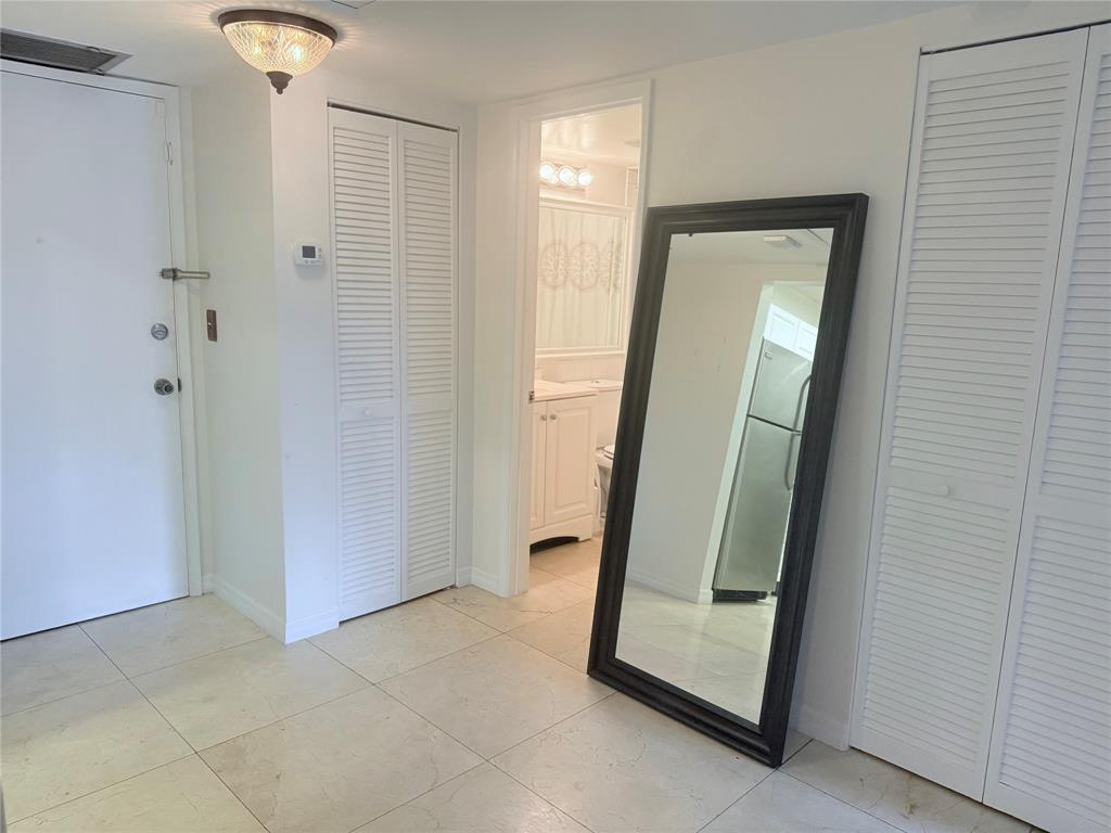 251 South Cypress Road, Unit 120 Pompano Beach, FL 33060 - Photo 6 of 42 a view of an entryway