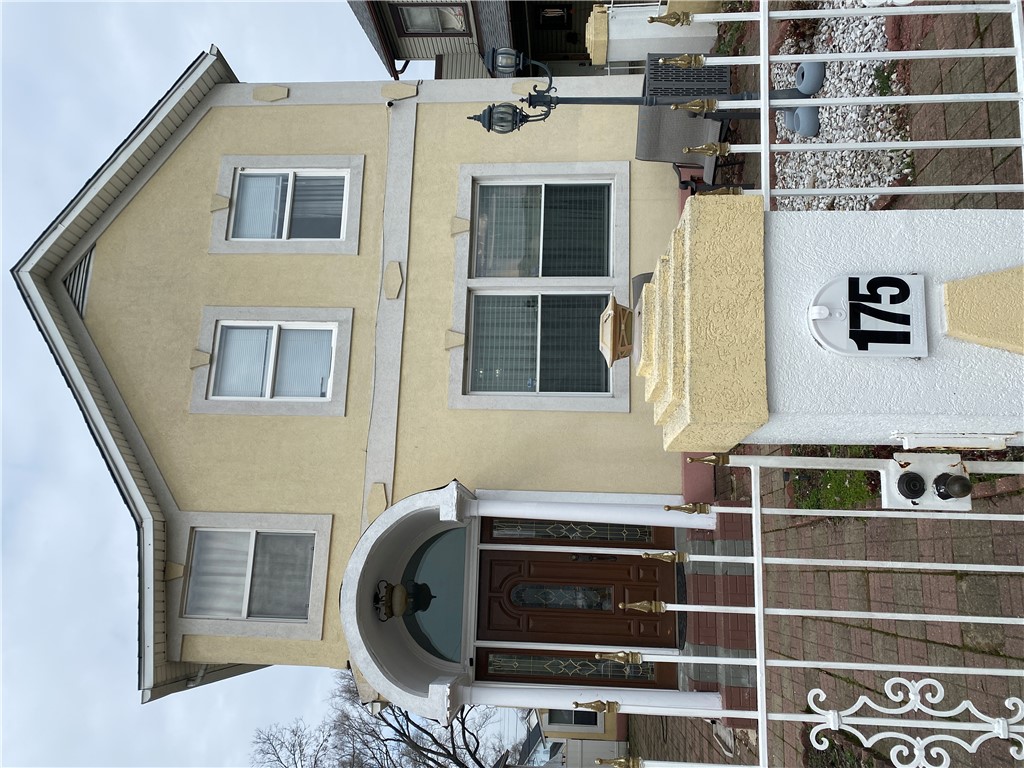 175 Rita Street Dayton, OH 45404 - Photo 9 of 48 This classic facade features an arched entryway, offering a welcoming introduction to the home.