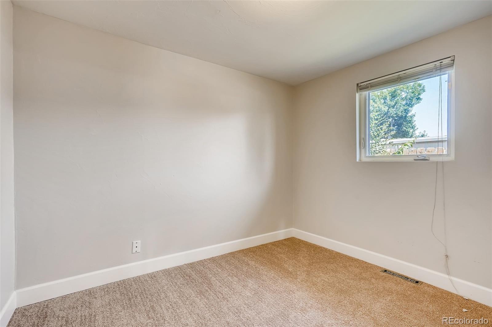 5535 Tejon Street Denver, CO 80221 - Photo 16 of 23 an empty room with a window