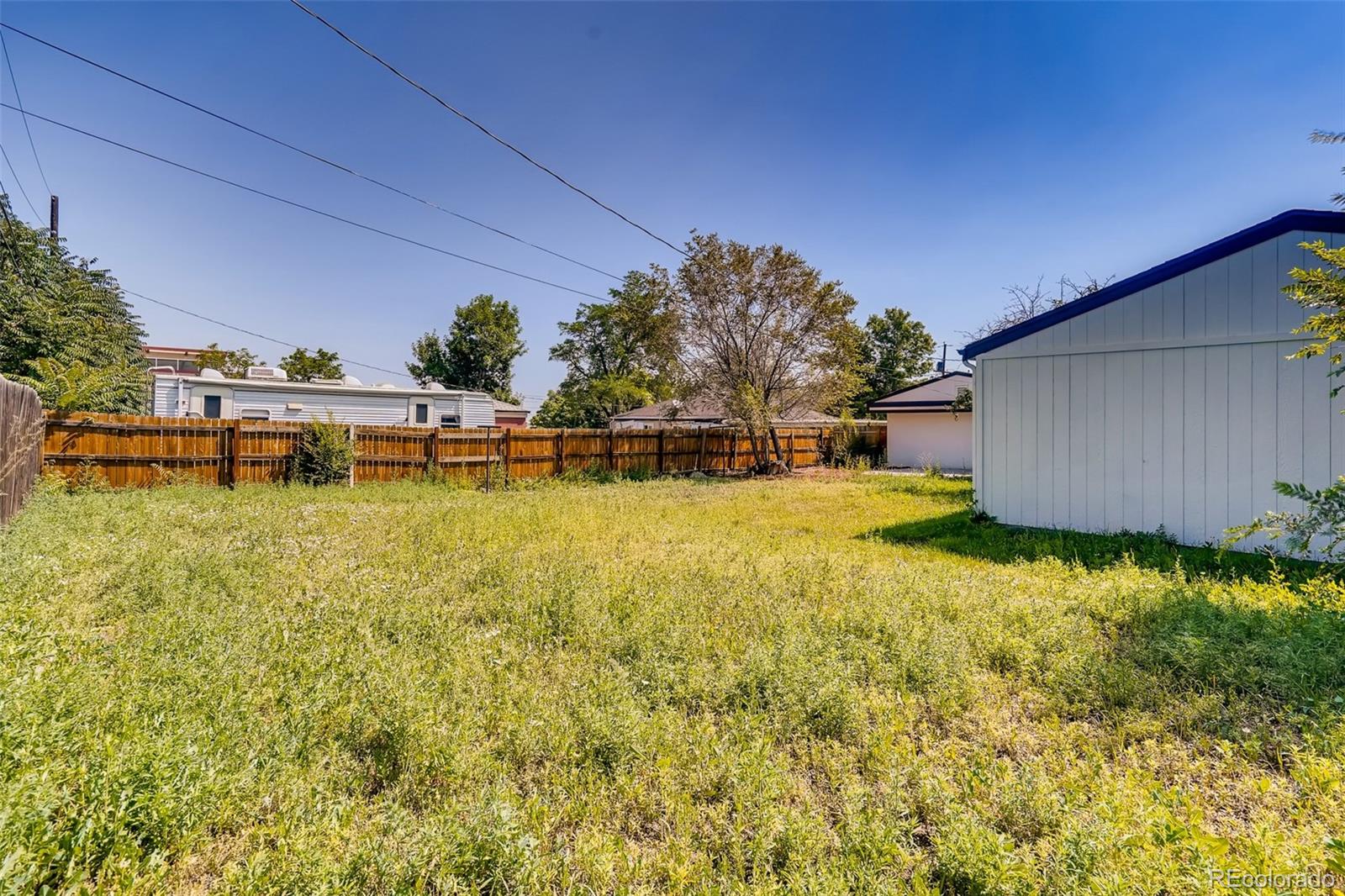 5535 Tejon Street Denver, CO 80221 - Photo 23 of 23 a view of a swimming pool with an outdoor space and seating area
