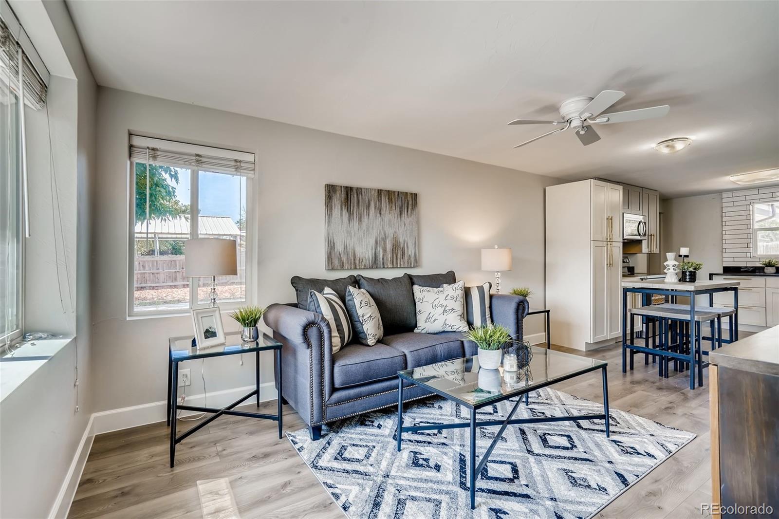 5535 Tejon Street Denver, CO 80221 - Photo 4 of 23 a living room with furniture and a large window