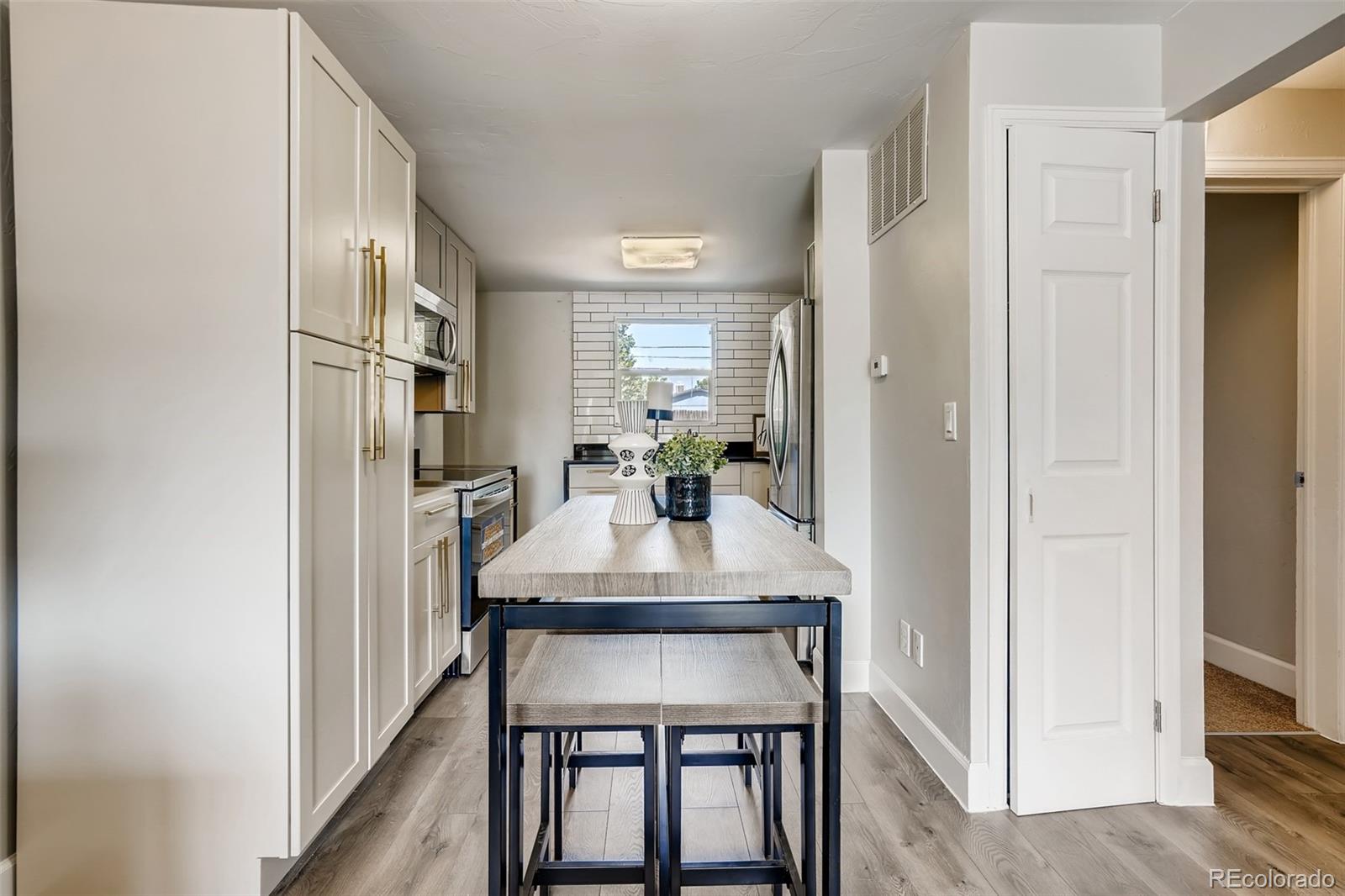 5535 Tejon Street Denver, CO 80221 - Photo 7 of 23 a view of a dining room with furniture
