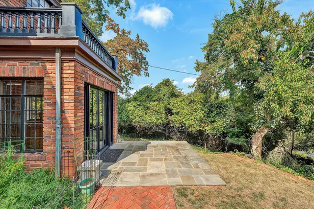 a white toilet sitting next to a shower curtain