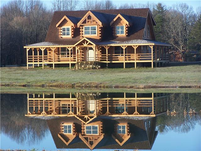 389 North Scenic Road Monteagle, TN 37356 - Photo 1 of 12 Custom crafted, a world famous, Battle Creek Log home sited on over 6 acres of solitude, with serene ponds, well-stocked for your enjoyment!