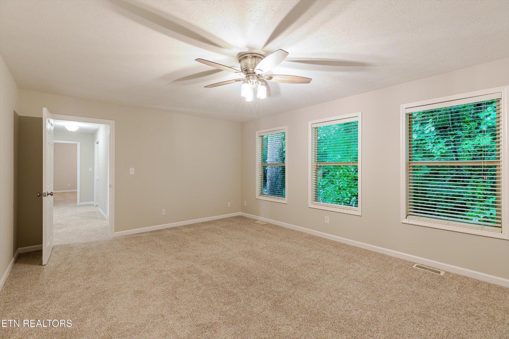 147 California Avenue Oak Ridge, TN 37830 - Photo 27 of 39 an empty room with windows and fan
