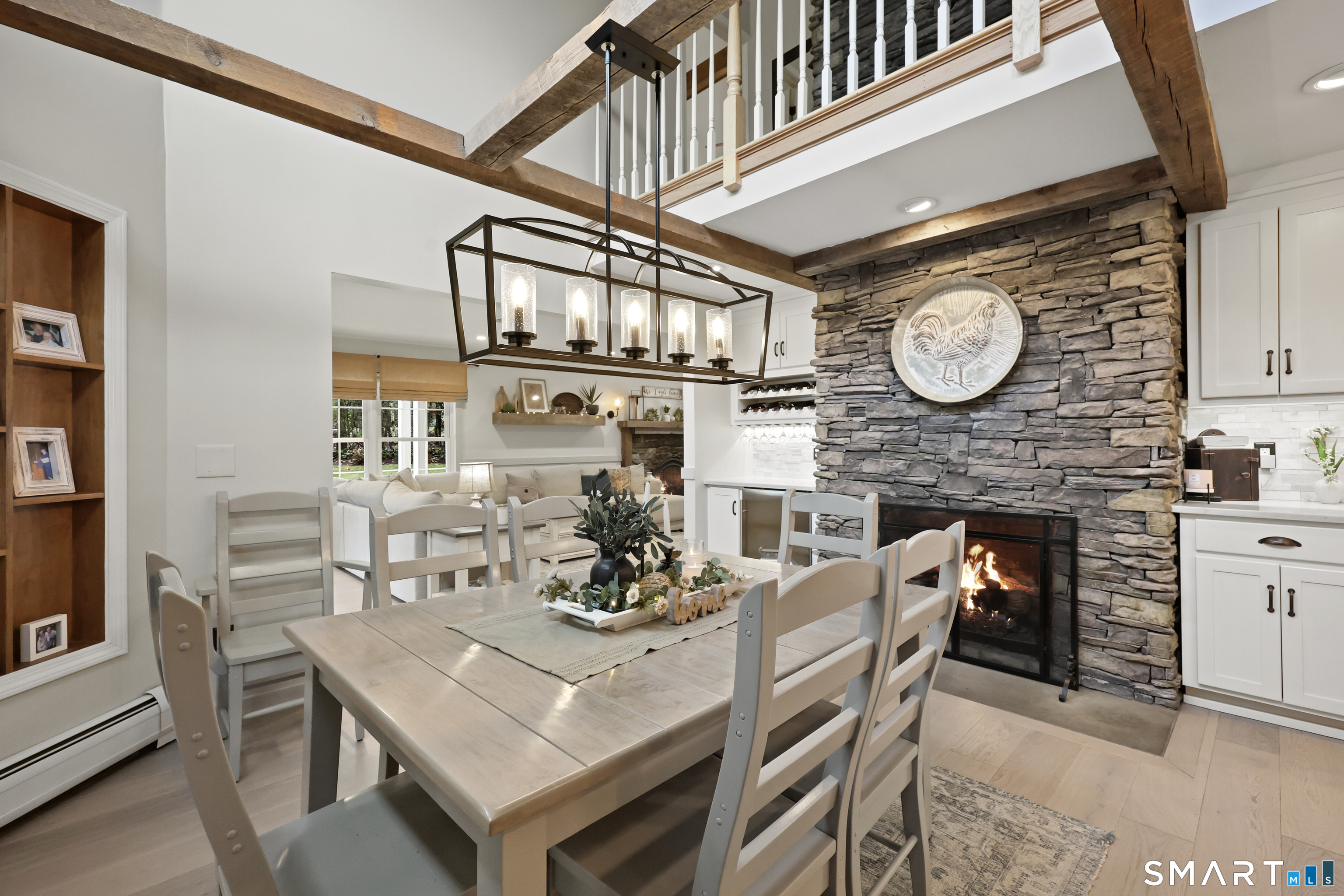 35 Quail Run Harwinton, CT 06791 - Photo 15 of 40 a view of a dining room with furniture and a clock
