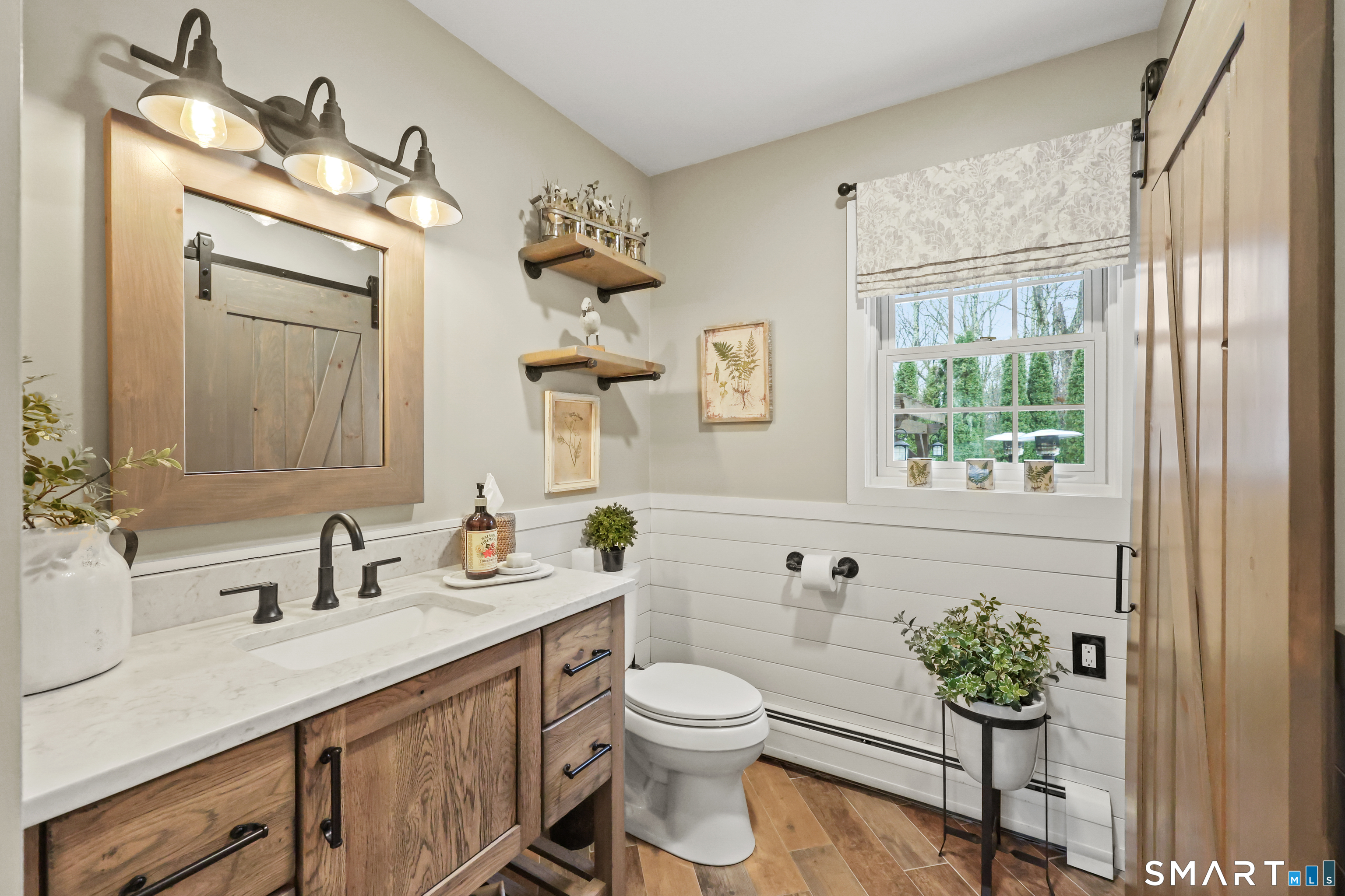 35 Quail Run Harwinton, CT 06791 - Photo 18 of 40 a bathroom with a granite countertop sink a toilet and a mirror