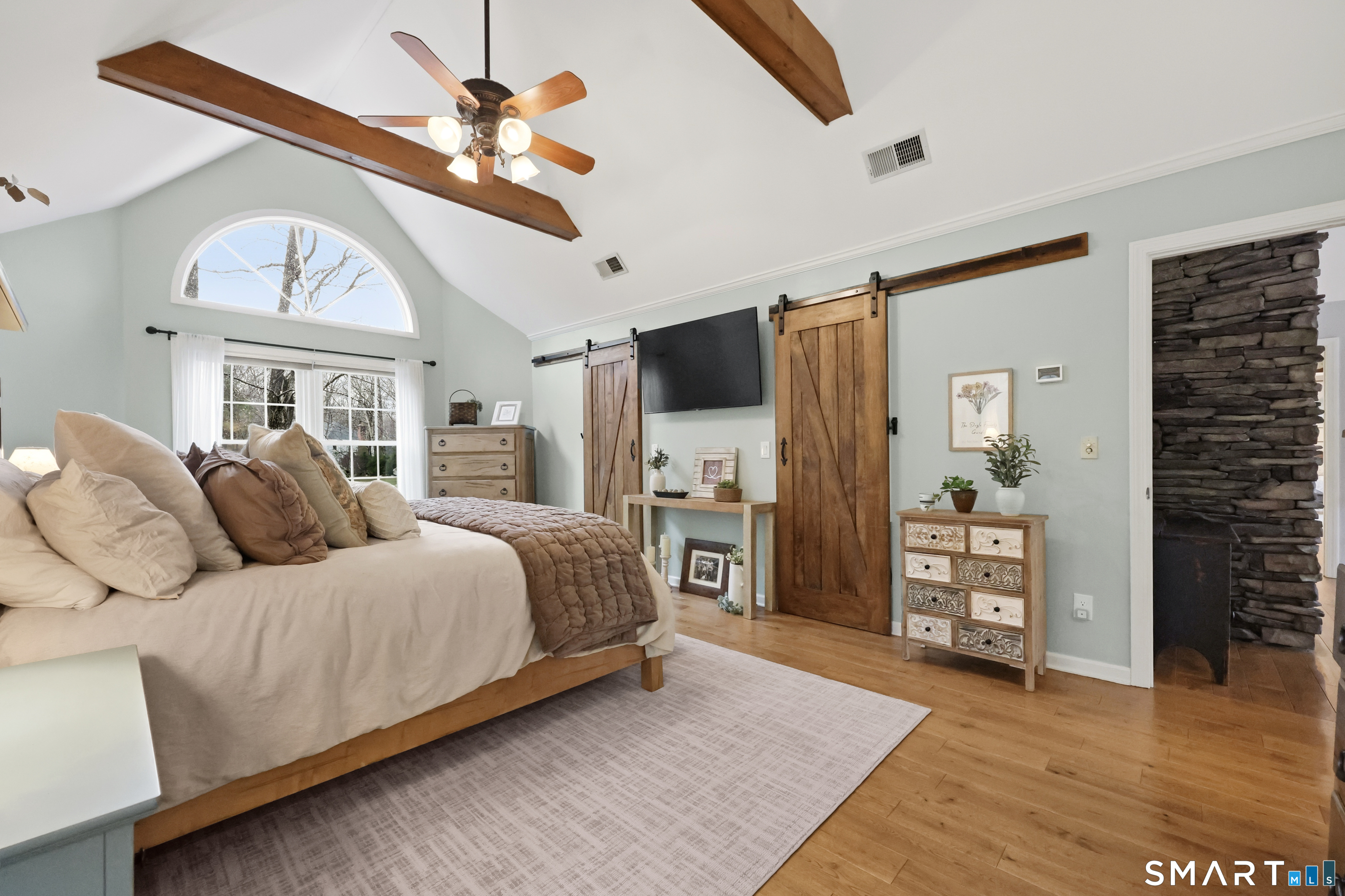 35 Quail Run Harwinton, CT 06791 - Photo 23 of 40 a spacious bedroom with a large bed a chandelier and closet