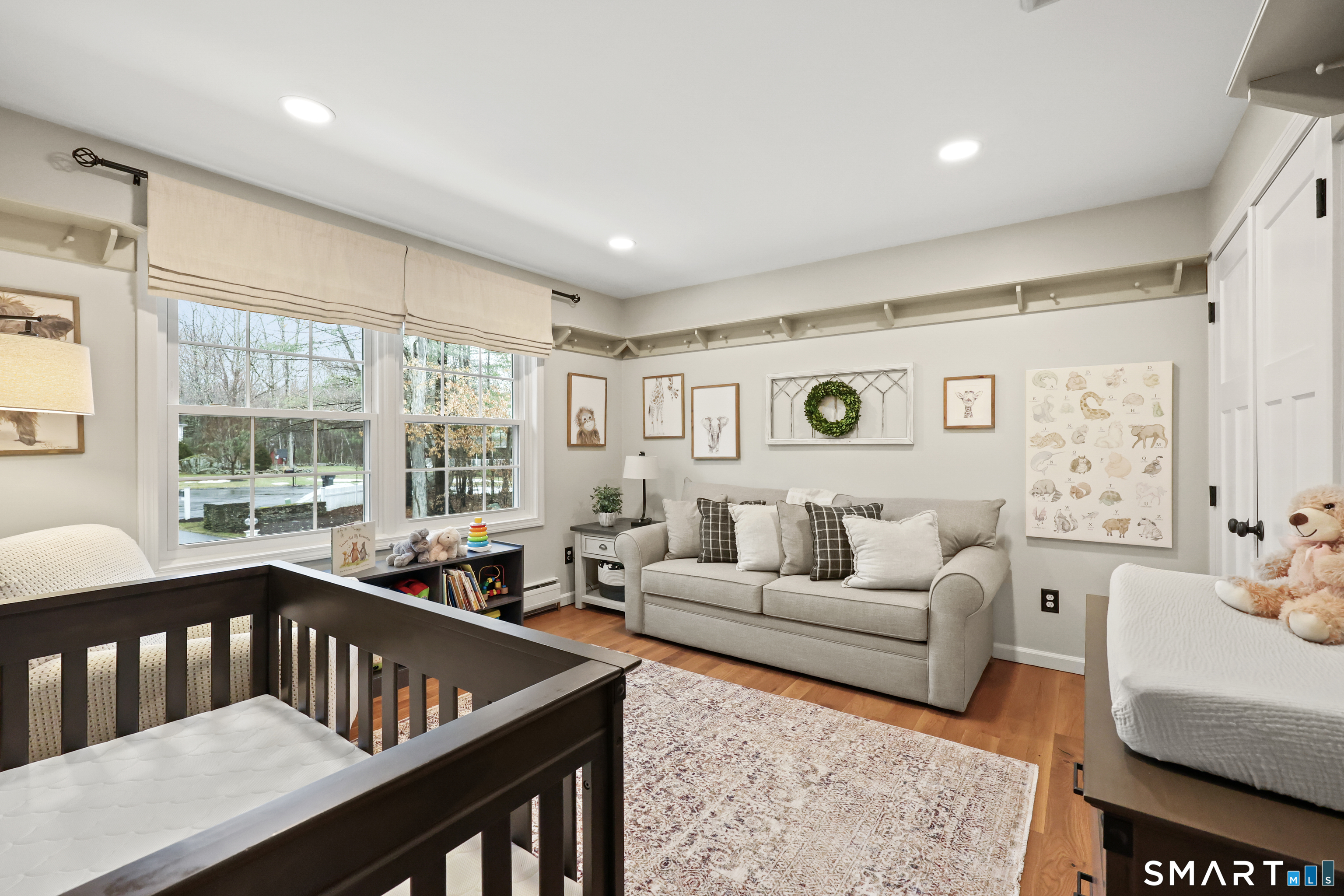 35 Quail Run Harwinton, CT 06791 - Photo 28 of 40 a living room with furniture wooden floor and a large window