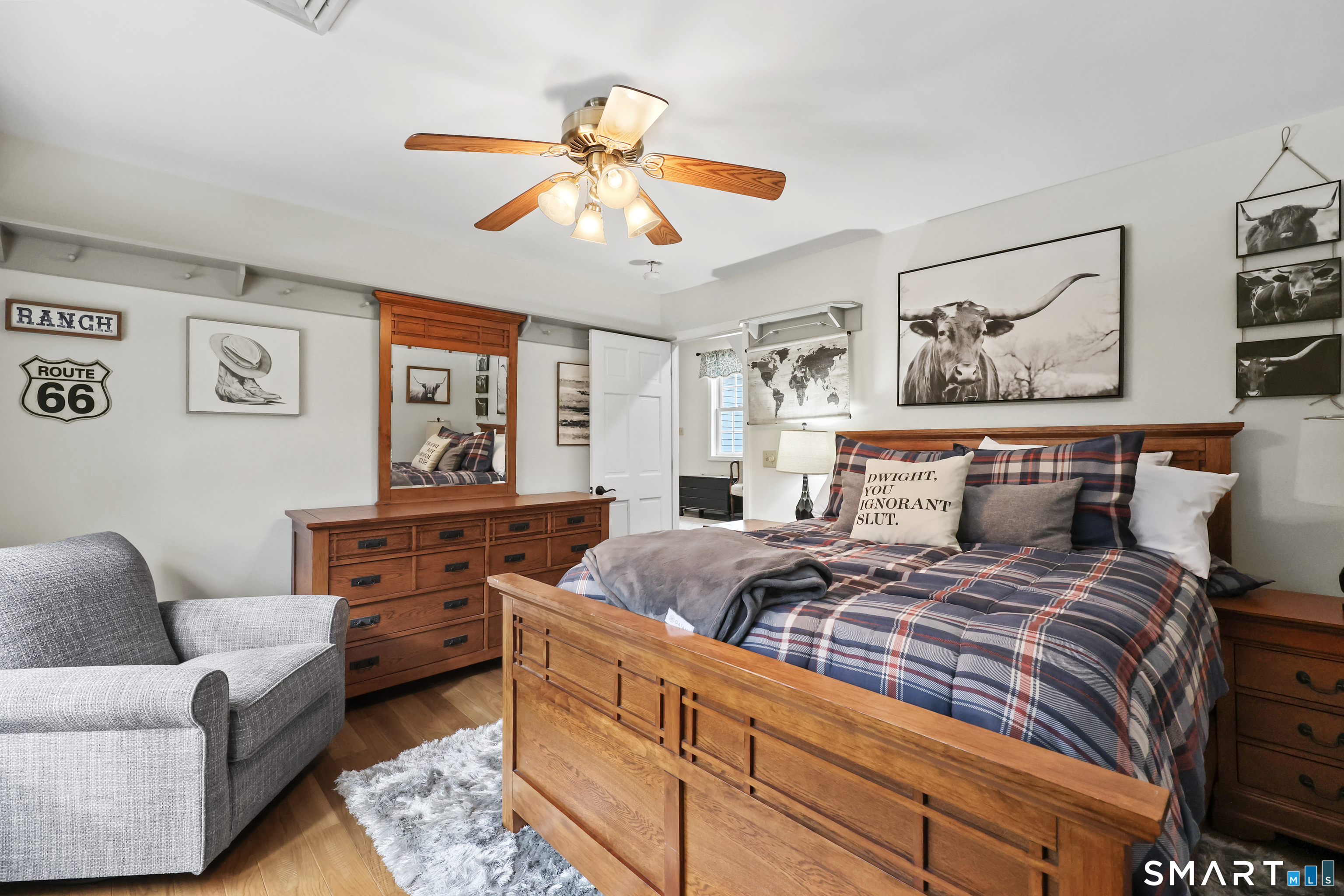 35 Quail Run Harwinton, CT 06791 - Photo 30 of 40 a bedroom with furniture and a chandelier