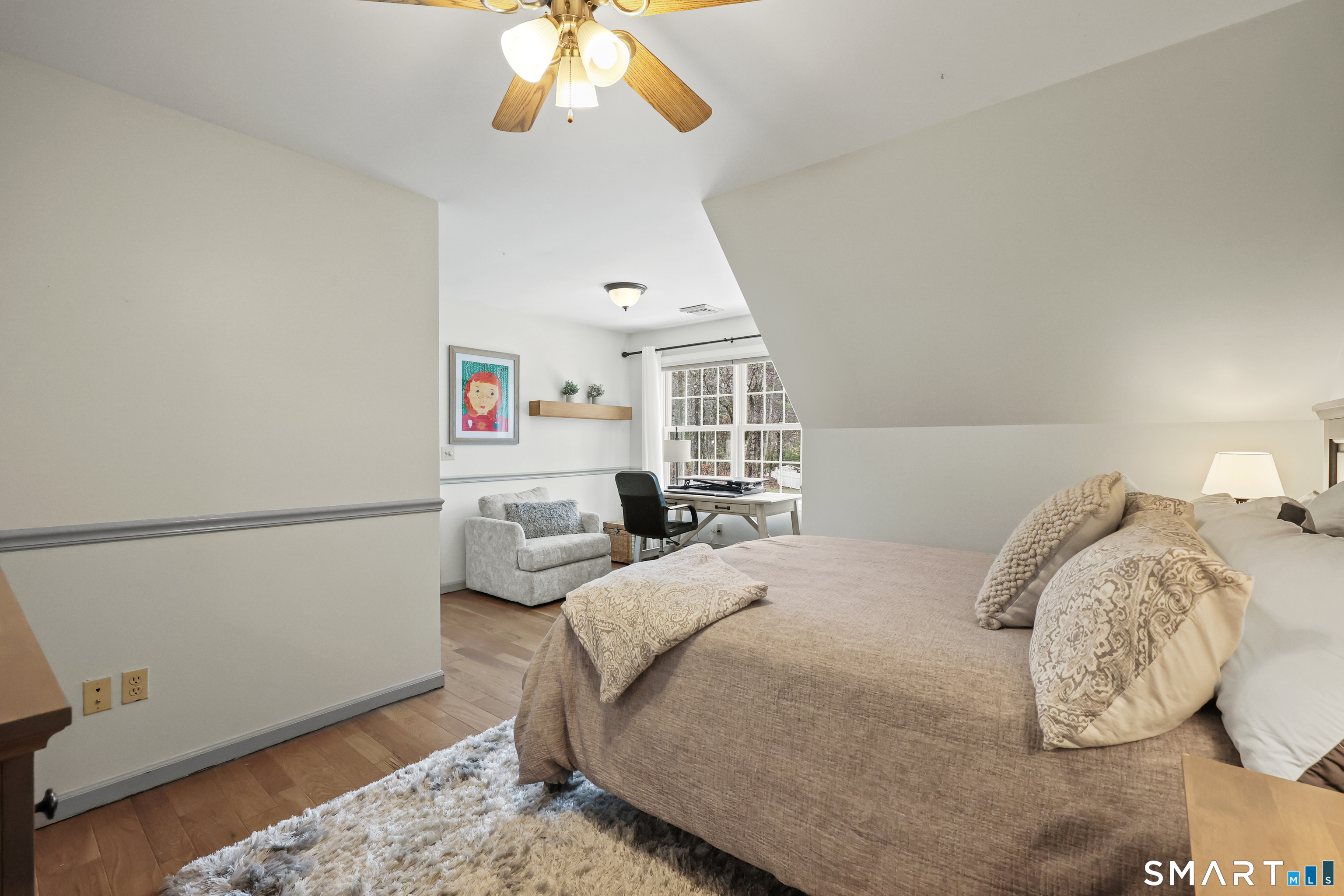 35 Quail Run Harwinton, CT 06791 - Photo 32 of 40 a bedroom with a bed and a chandelier