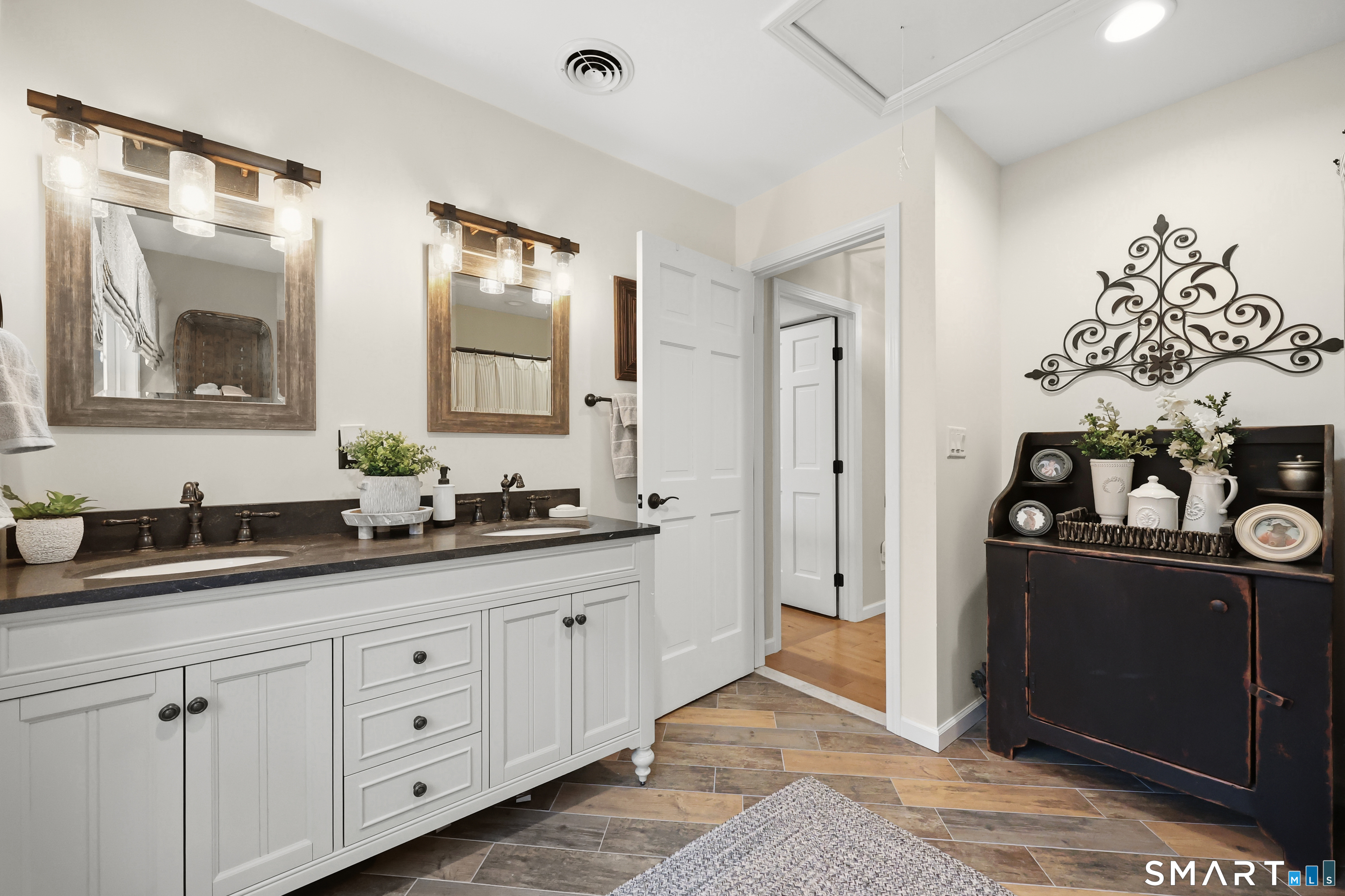 35 Quail Run Harwinton, CT 06791 - Photo 33 of 40 a bathroom with a double vanity sink and mirror