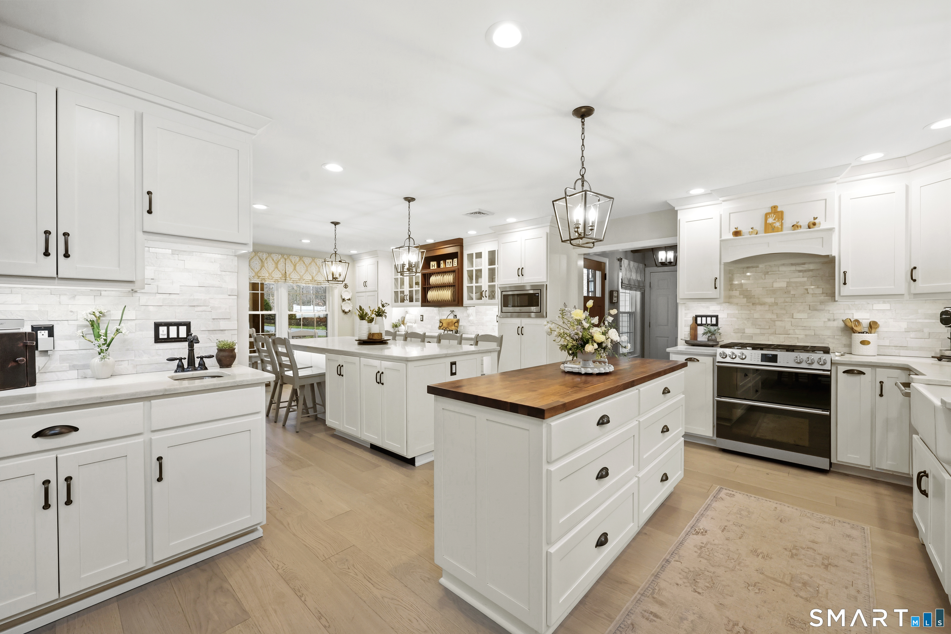 35 Quail Run Harwinton, CT 06791 - Photo 7 of 40 a kitchen with white cabinets and appliances
