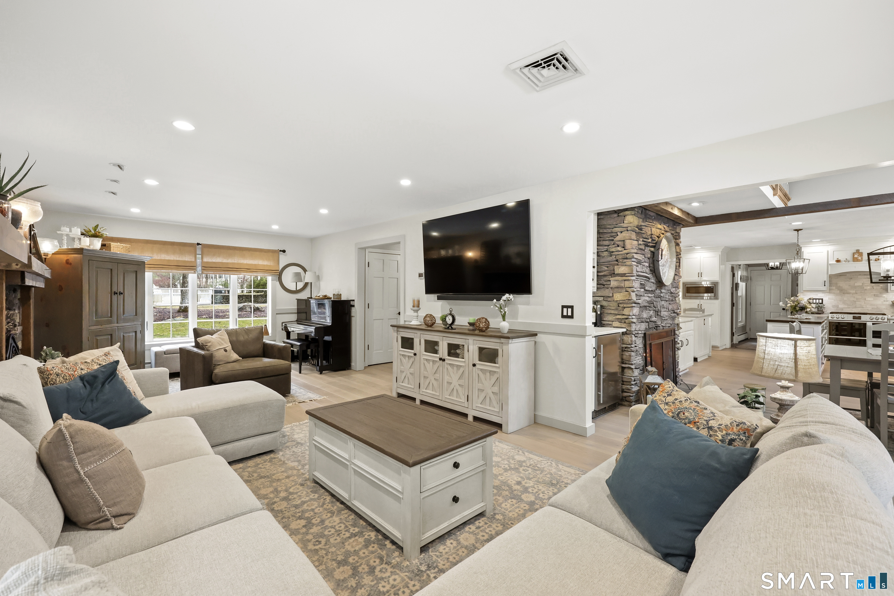 35 Quail Run Harwinton, CT 06791 - Photo 10 of 40 a living room with furniture and a flat screen tv