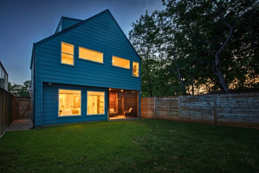 916 East 50th Street, Unit 1 Austin, TX 78751 - Photo 11 of 36 The house glows at night -- highlighting all of the huge windows throughout the home -- but still feels very private.
