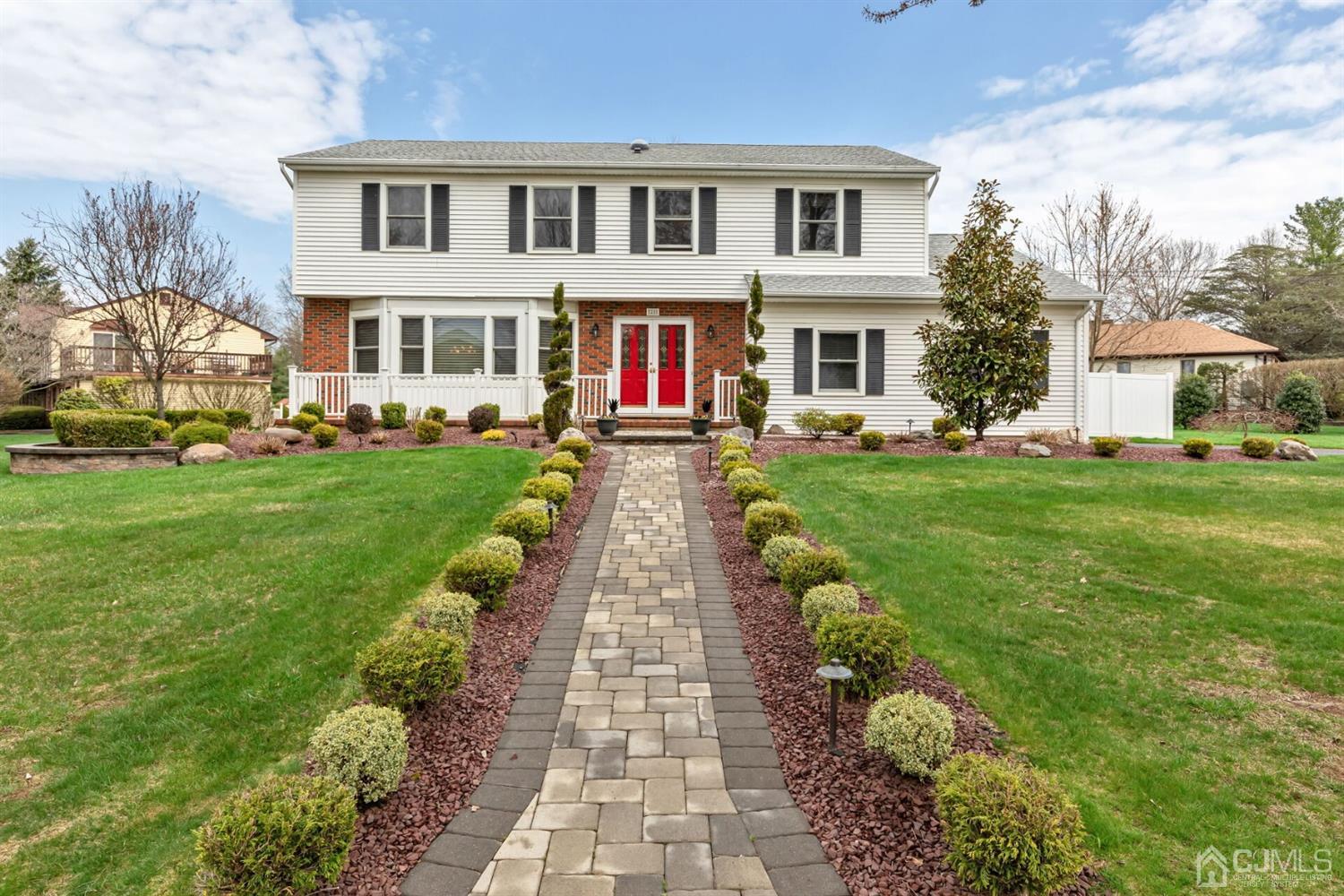 28 Harkins Road Milltown, NJ 08850 - Photo 2 of 46 a front view of a residential houses with yard and green space