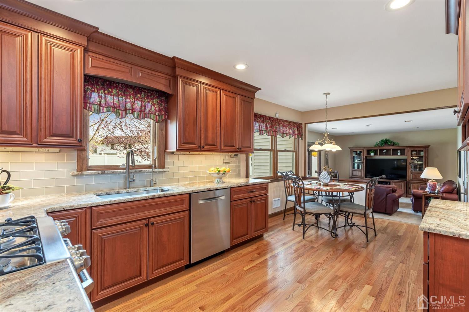 28 Harkins Road Milltown, NJ 08850 - Photo 13 of 46 a kitchen with lots of counter top space and dining table