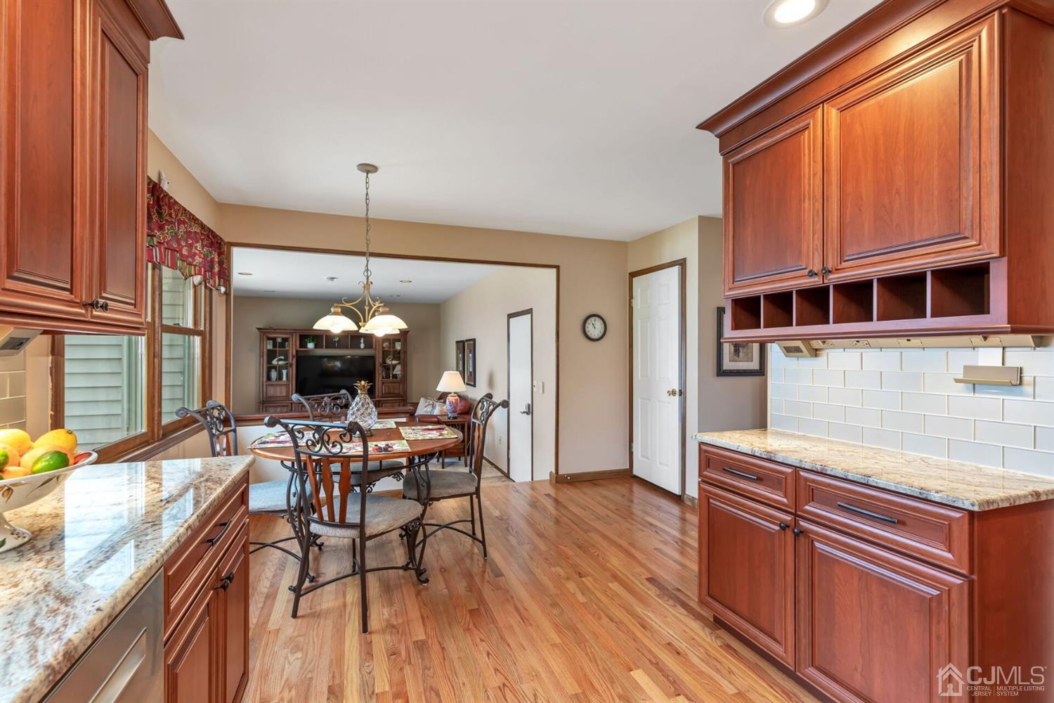 28 Harkins Road Milltown, NJ 08850 - Photo 14 of 46 a view of a dining room with furniture window and wooden floor