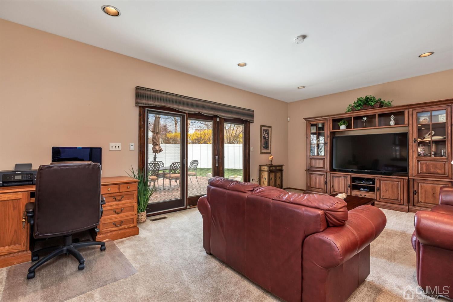 28 Harkins Road Milltown, NJ 08850 - Photo 19 of 46 a living room with furniture and a flat screen tv