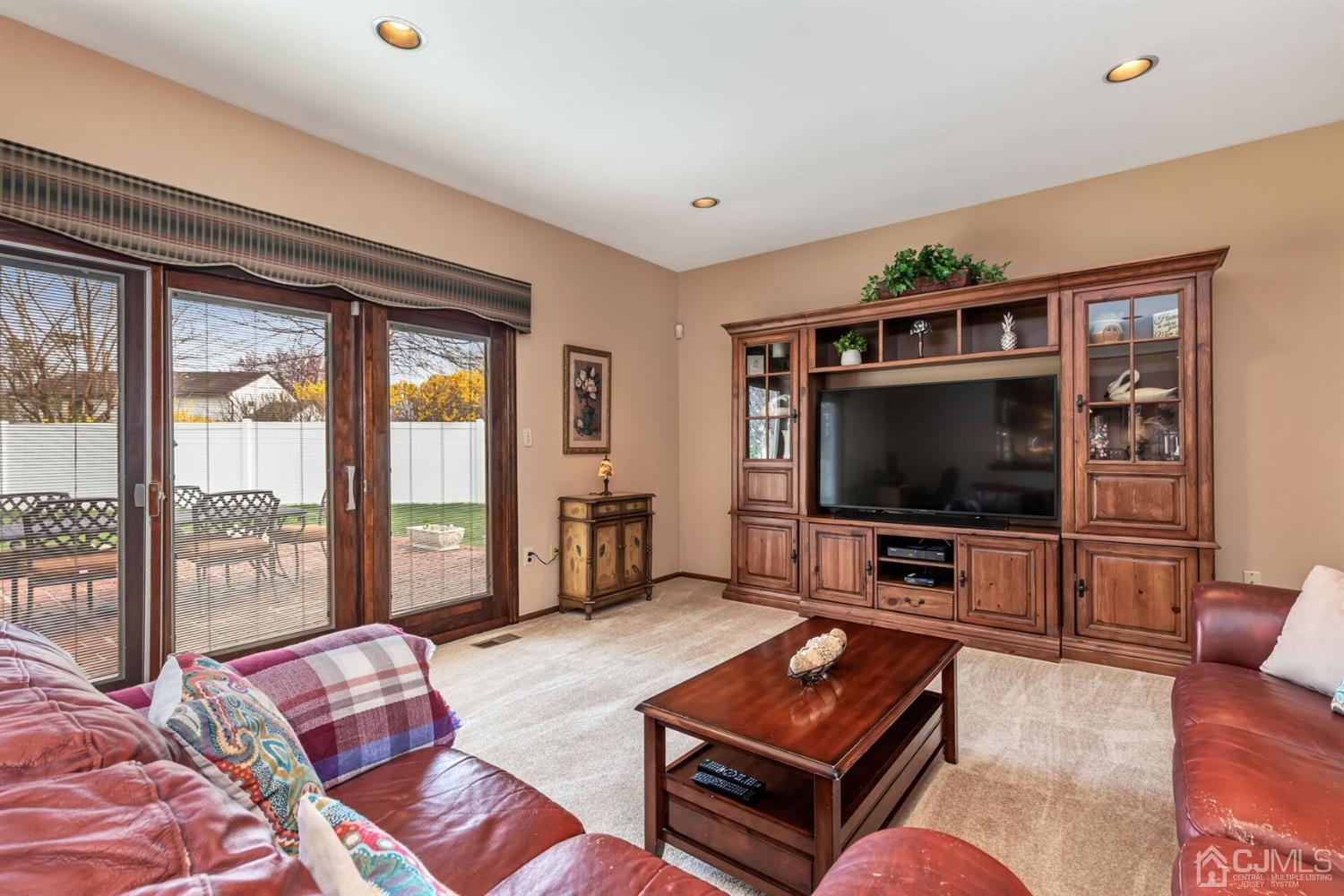 28 Harkins Road Milltown, NJ 08850 - Photo 20 of 46 a living room with furniture and a flat screen tv