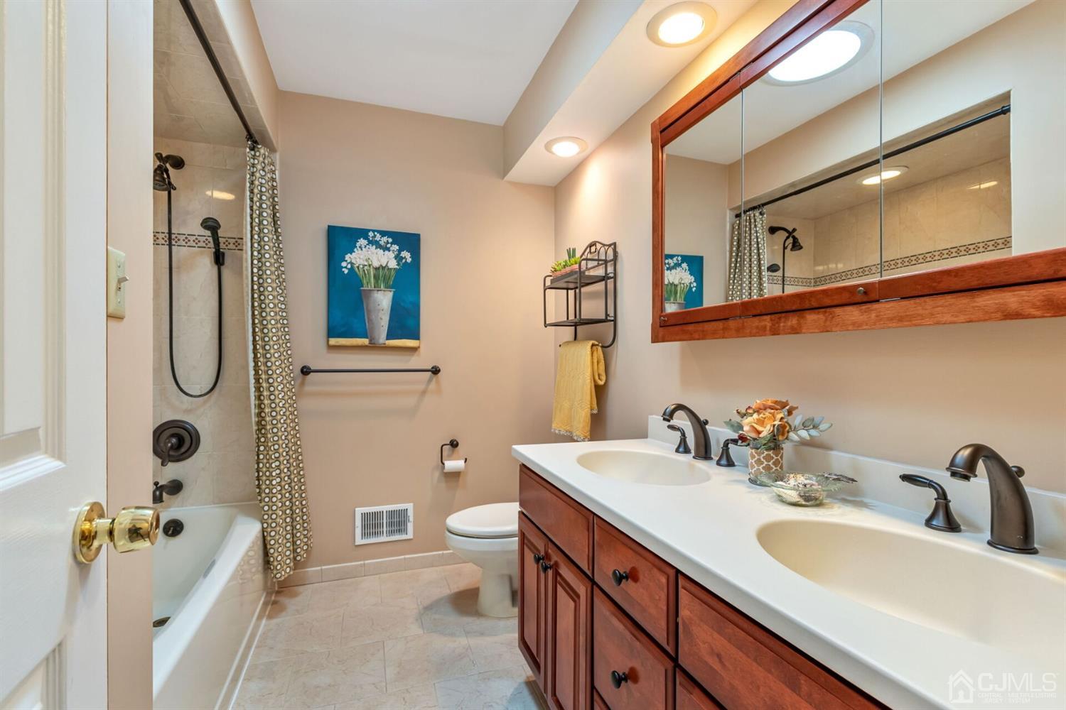 28 Harkins Road Milltown, NJ 08850 - Photo 24 of 46 a bathroom with a sink double vanity granite tub shower and mirror
